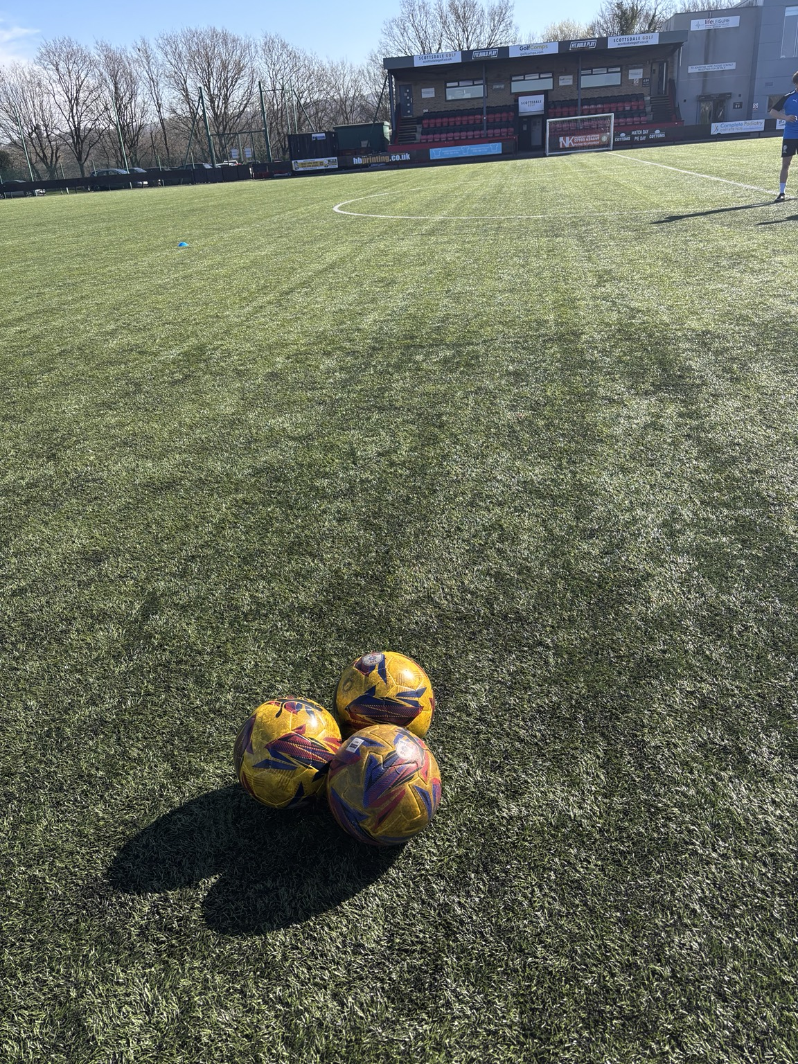 Football pitch with training balls ready for a session